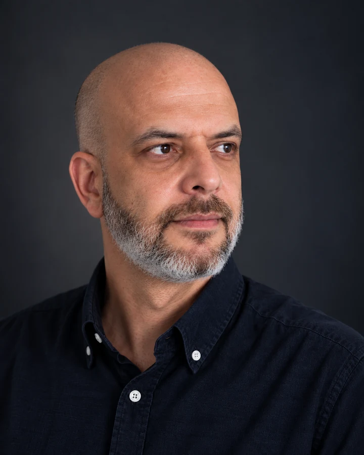 Professional portrait of Rosen Stanev looking to the right